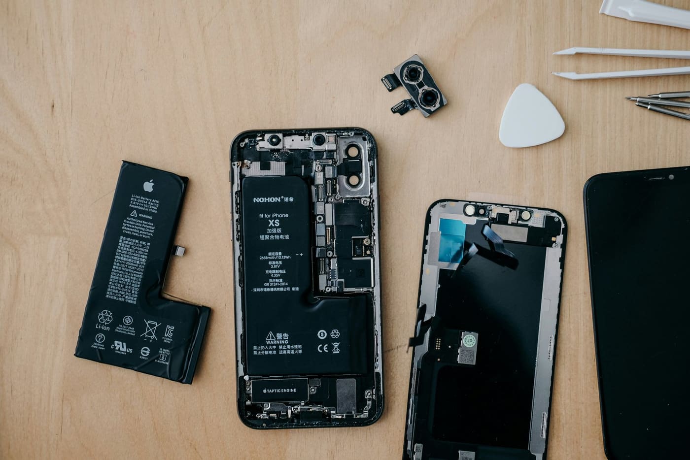 Technician replacing a phone battery